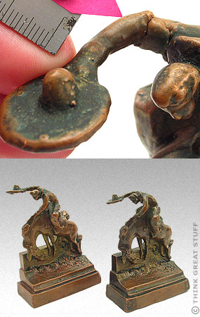 Illustration photo: A tear in the bronze-cladding of a cowboy theme bookend